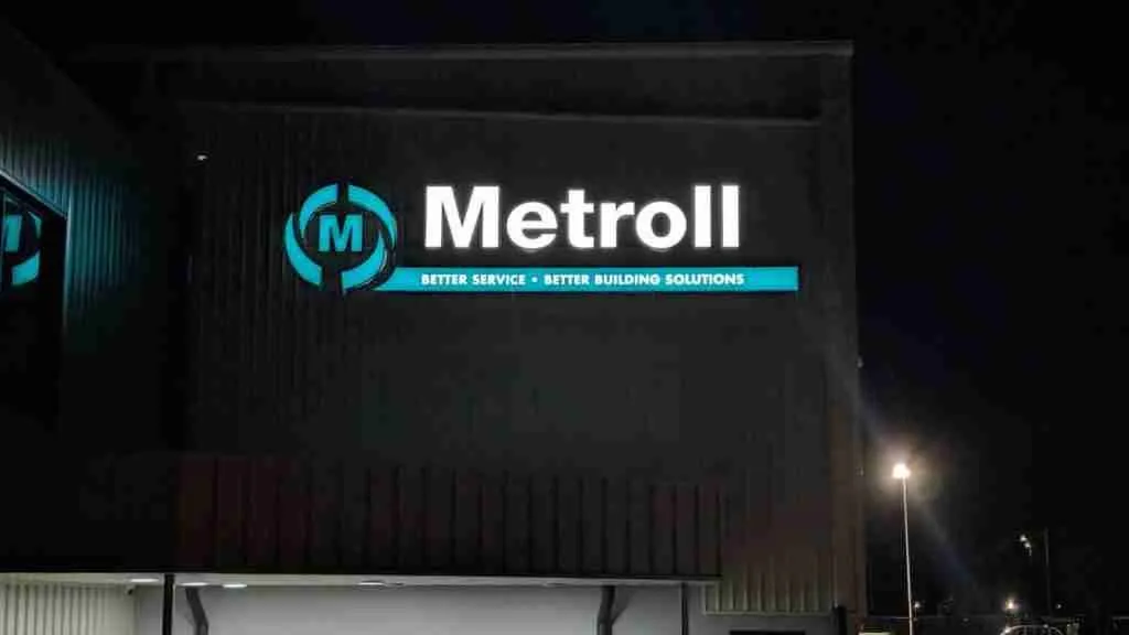 Illuminated channel-letter building signage photographed at night
