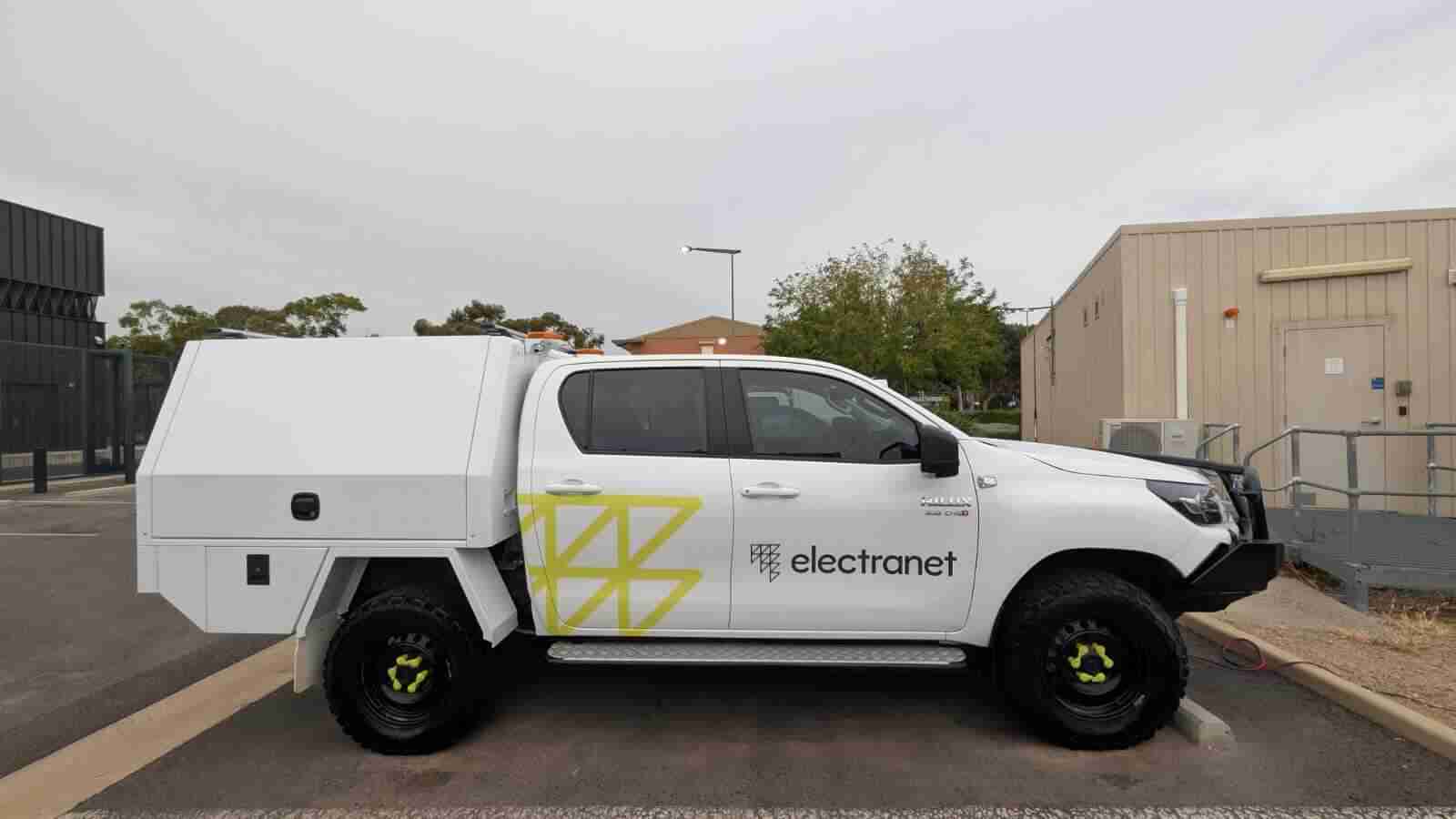 White utility vehicle with ElectraNet branding