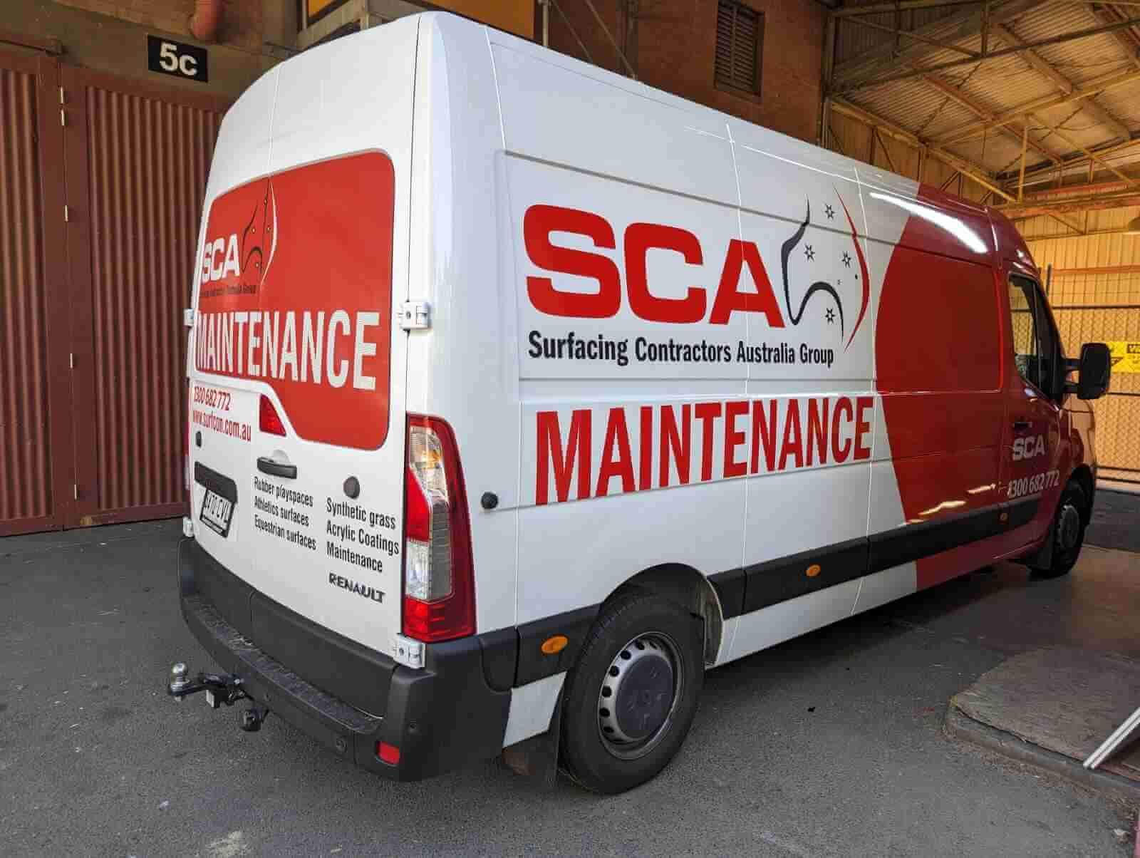 Branded maintenance van parked indoors.