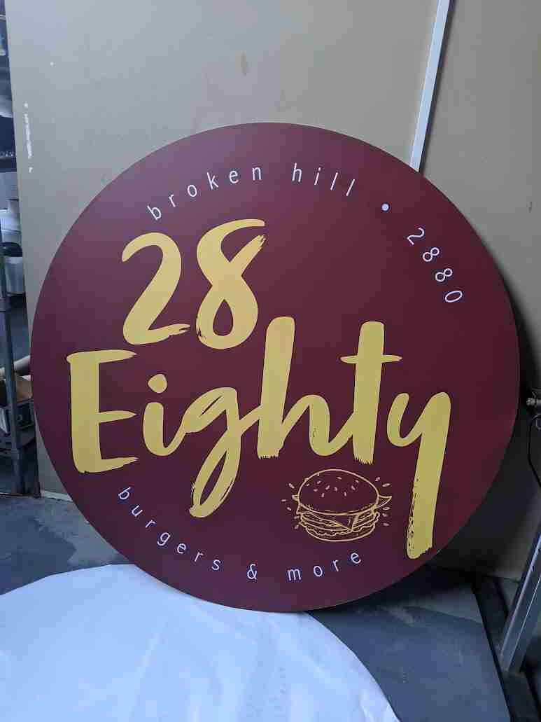 28 Eighty café circular window decal with gold script branding