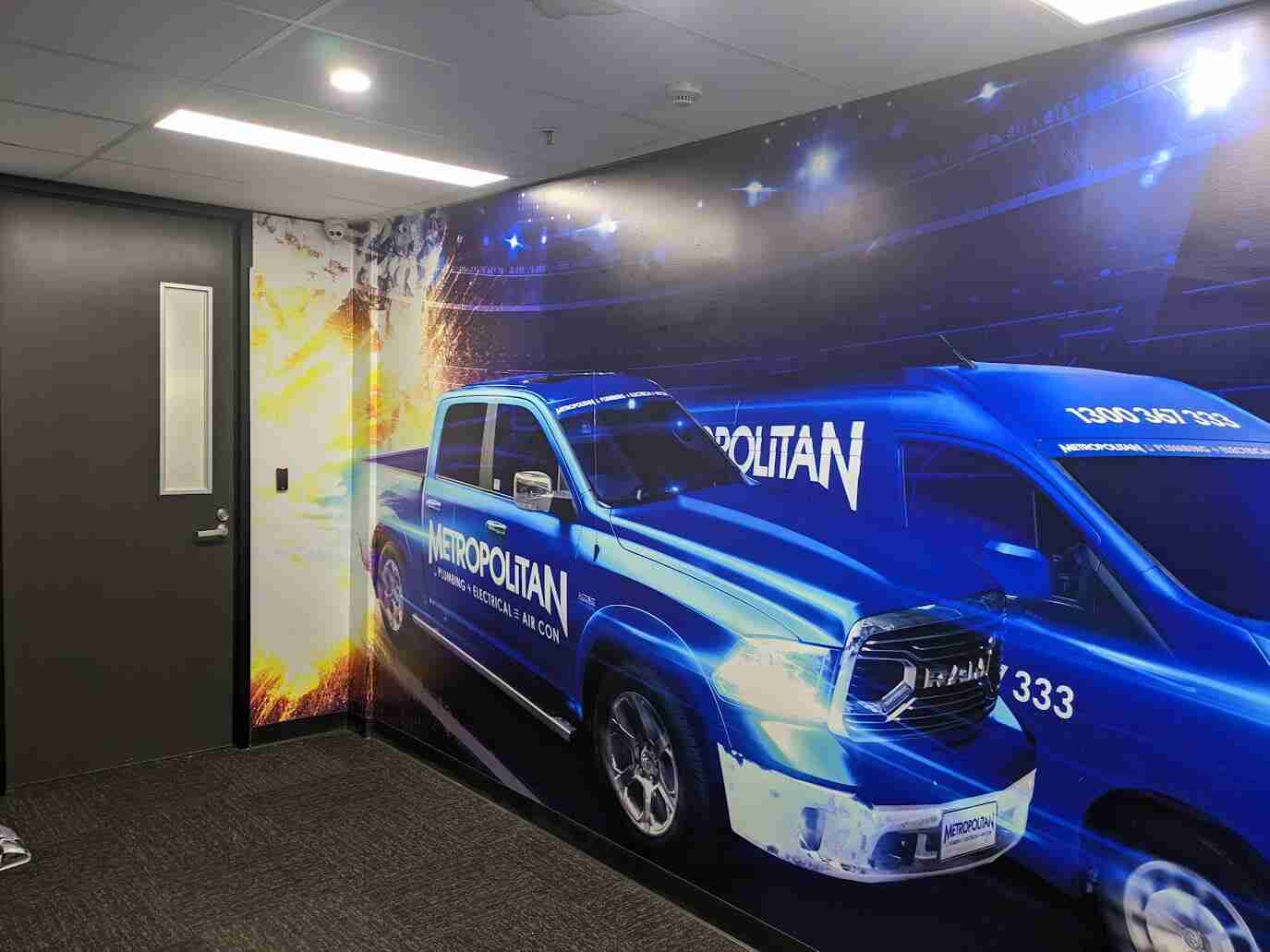 Blue truck mural on office wall