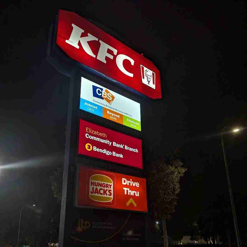 KFC sign with nearby businesses listed
