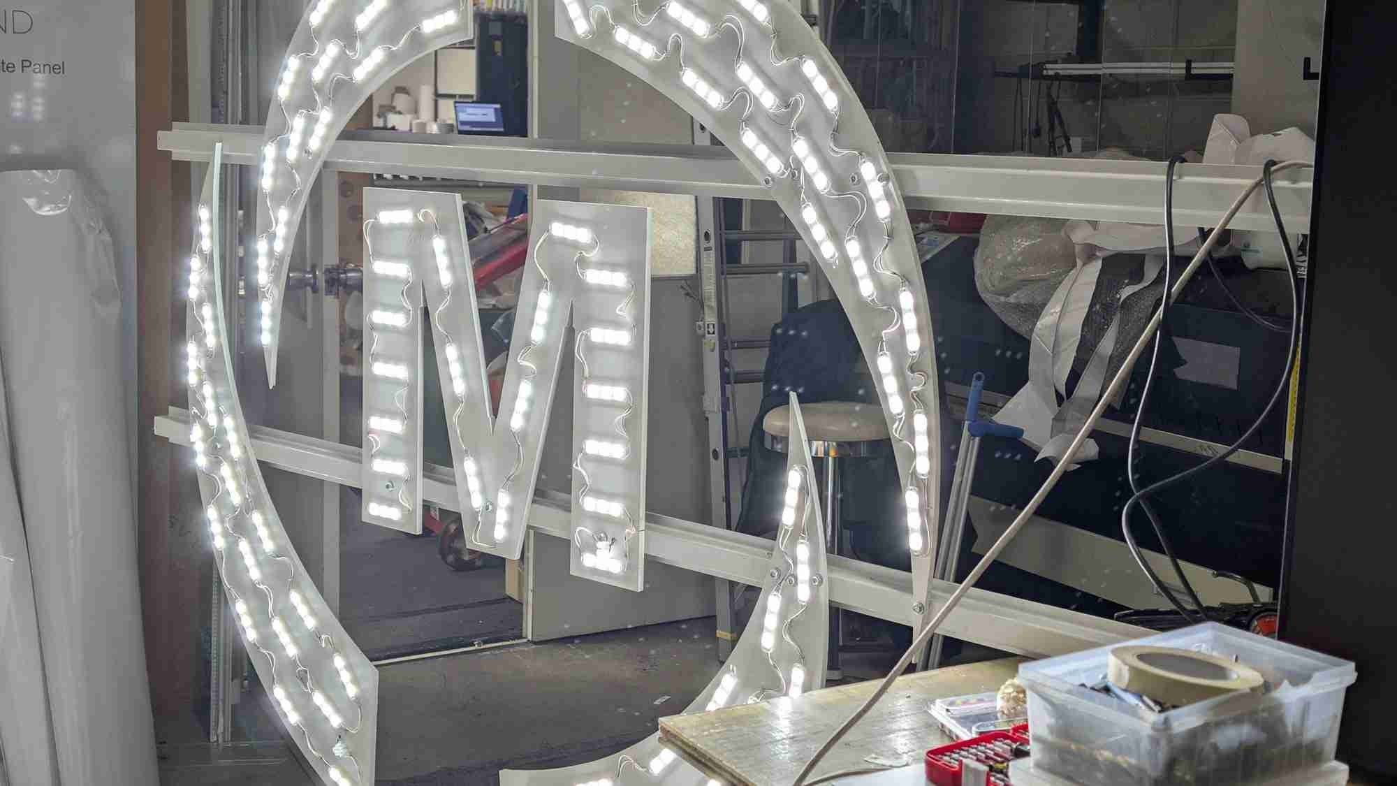 fabricated 3D circle letter sign mid-build in the Kent Town workshop with LED modules exposed - gigantic signs adelaide