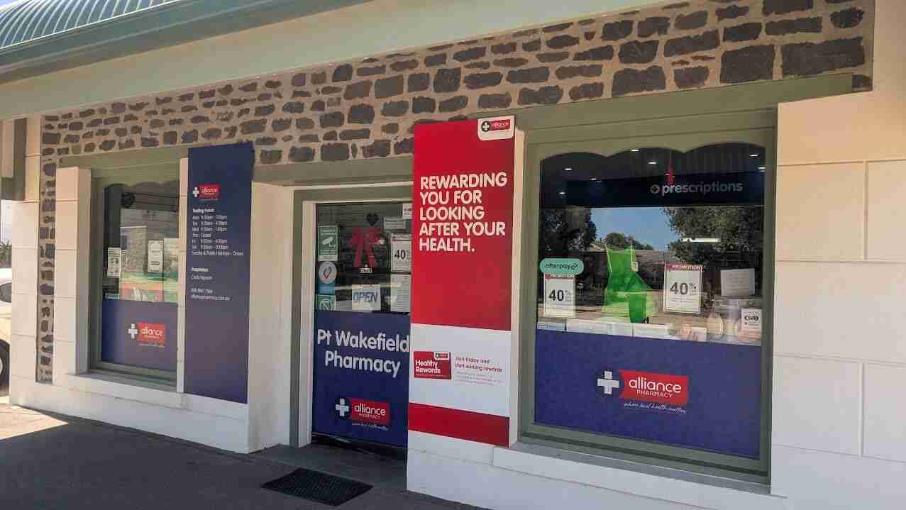 Pharmacy storefront with health promotions.