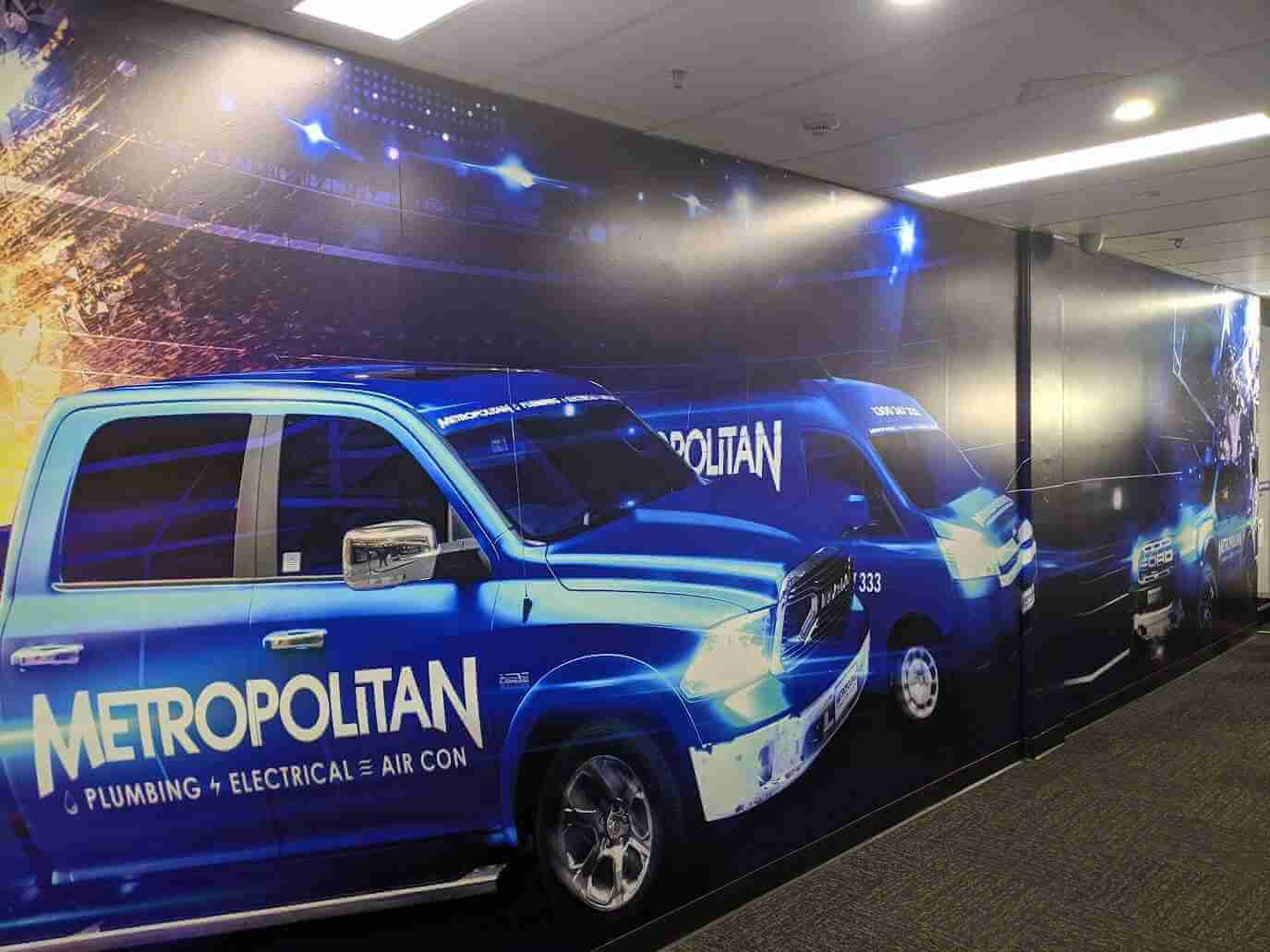 Metropolitan-branded fleet vehicle wall graphic in commercial hallway