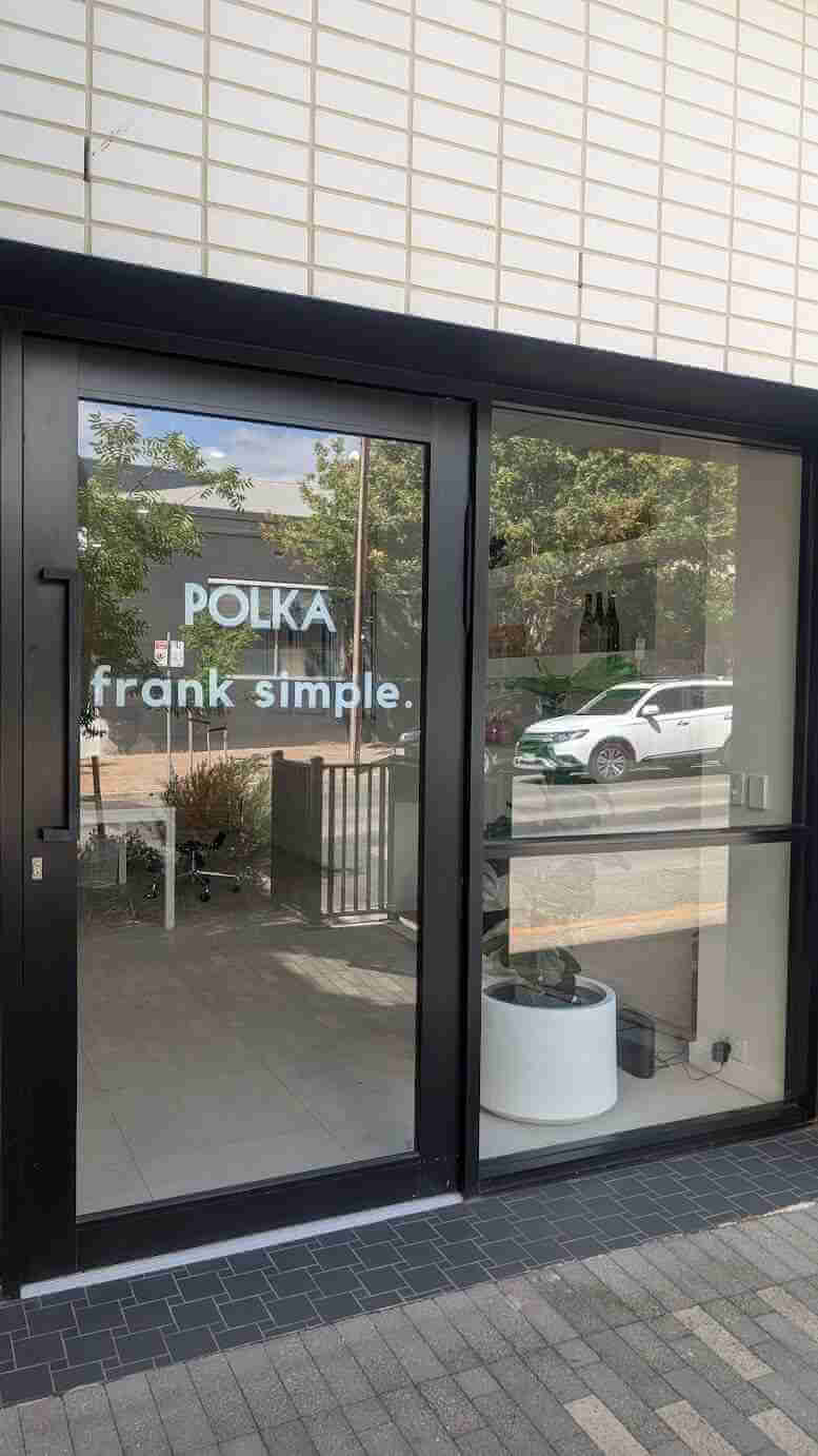 Polka Frank Simple logo and text applied as white vinyl window signage
