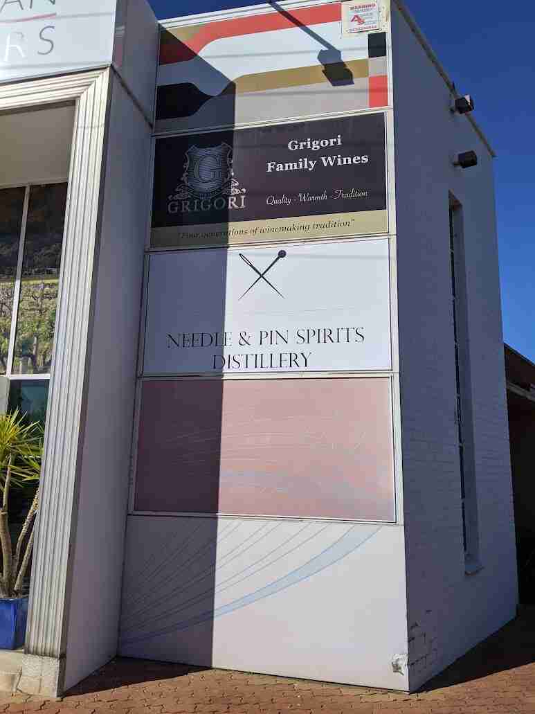 Vertical outdoor banner signage installed on column