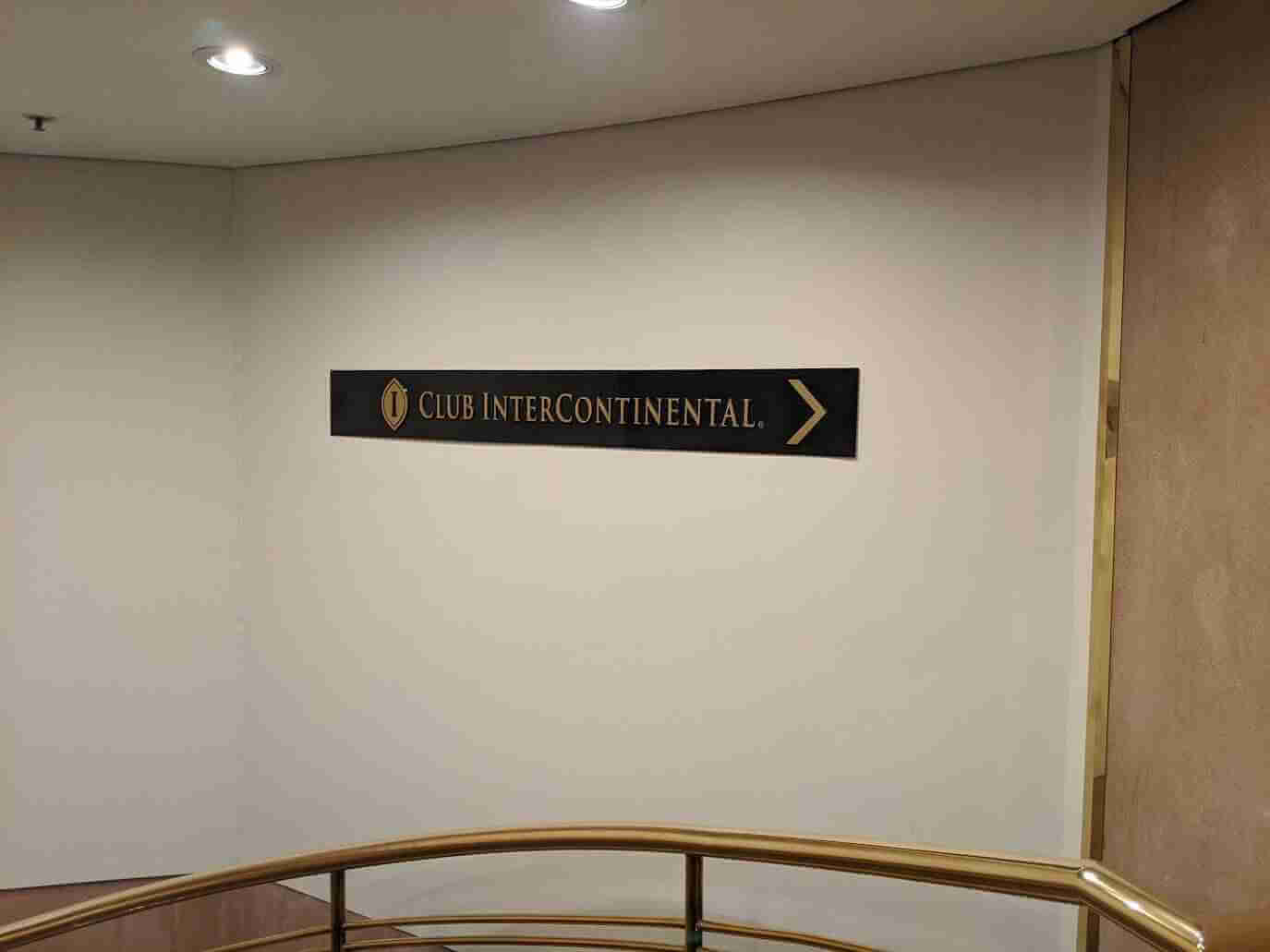 Directional wall sign pointing to Don Dunstan area in commercial building