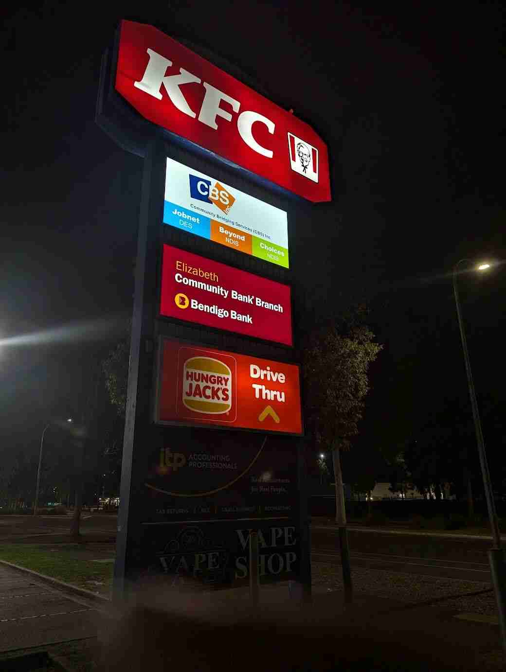 KFC sign with nearby businesses listed