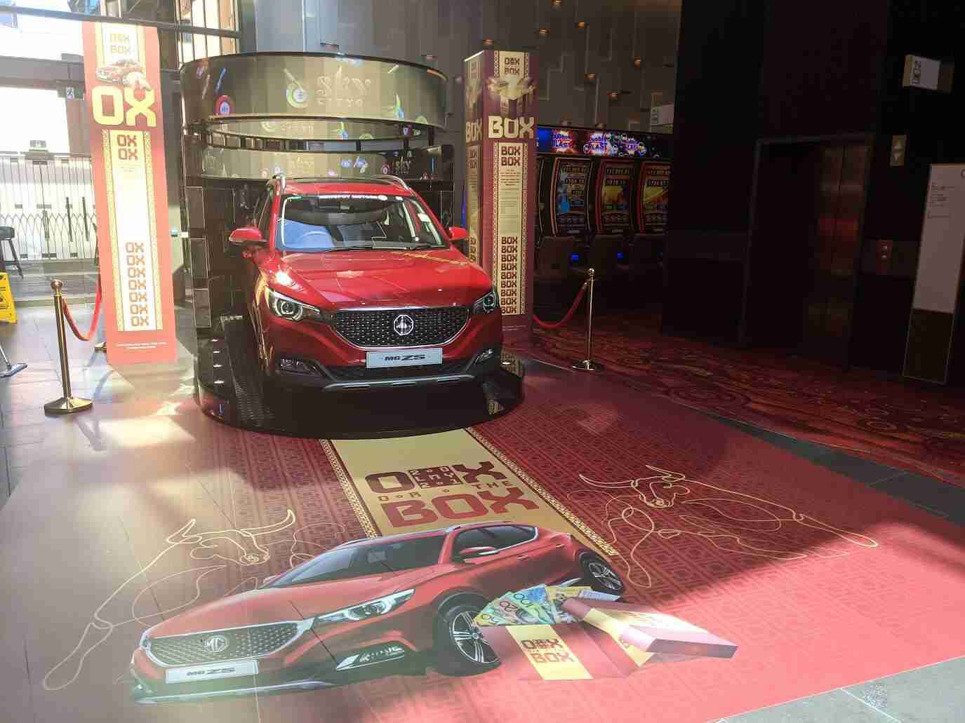Red car display at casino entrance