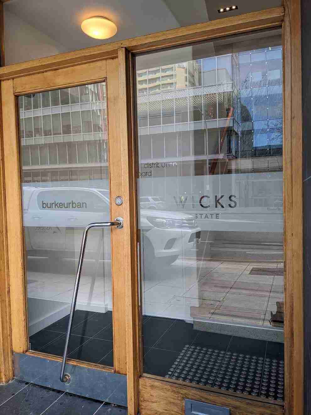 Frosted glass window graphics featuring abstract icon designs in workspace