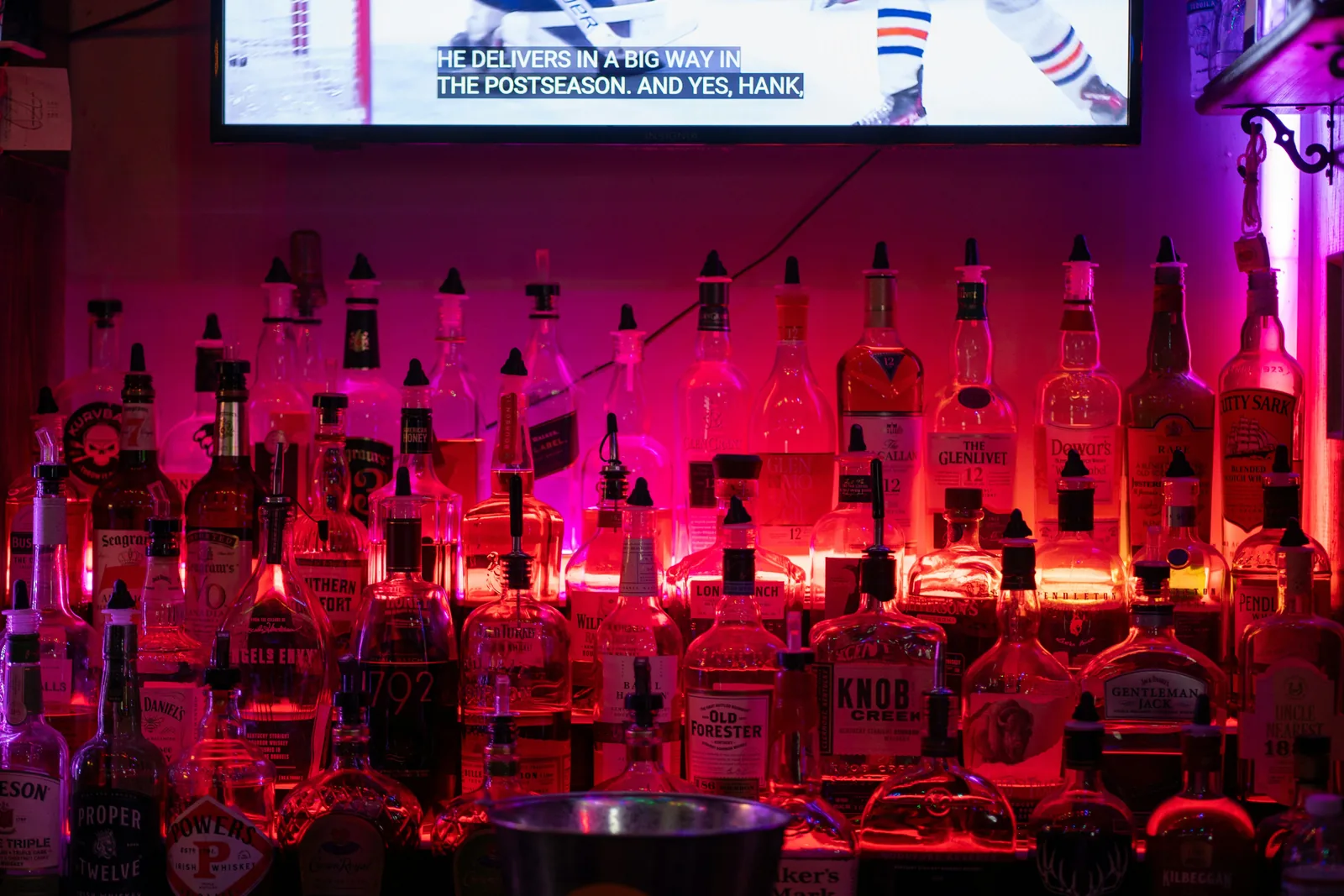 LED screen above a bar creating an engaging atmosphere in a hospitality venue