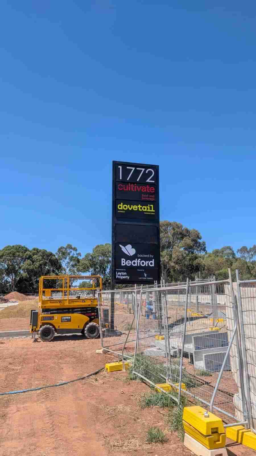 Construction site sign with logos