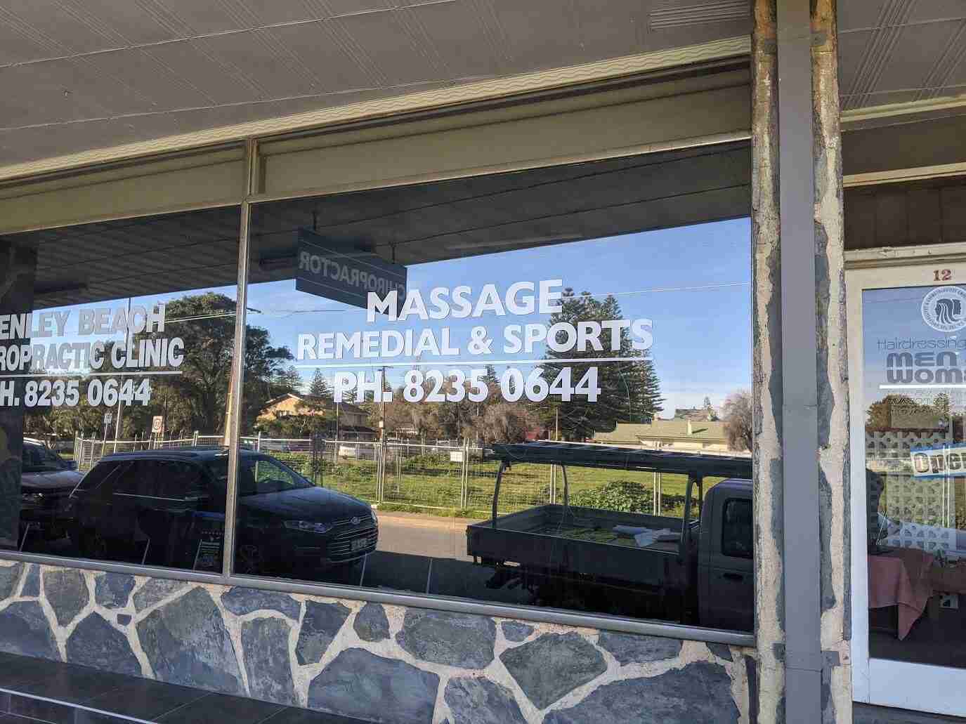 Massage and remedial sports therapy window signage with white vinyl text