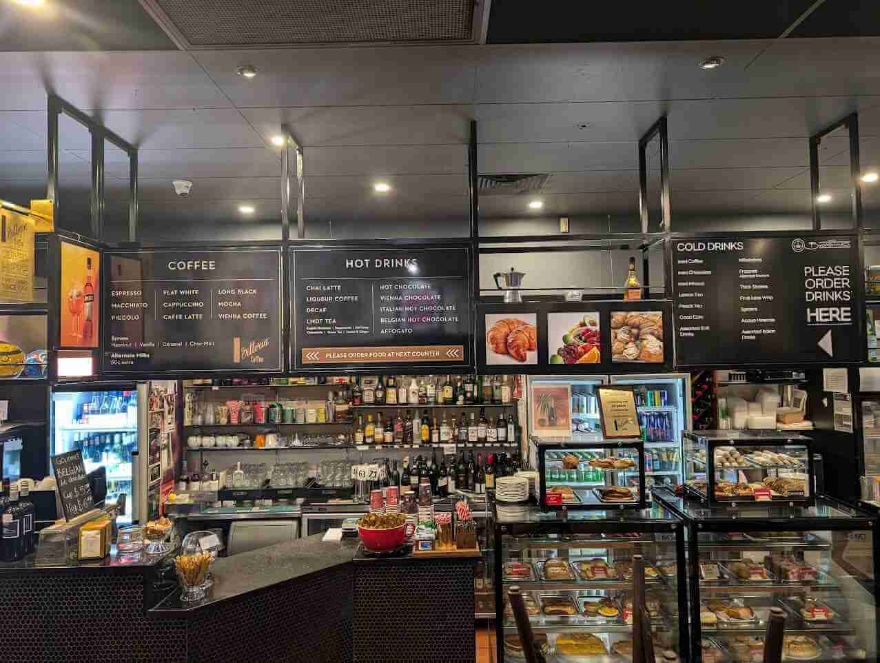 Large-format café menu boards with clear food and drink listings