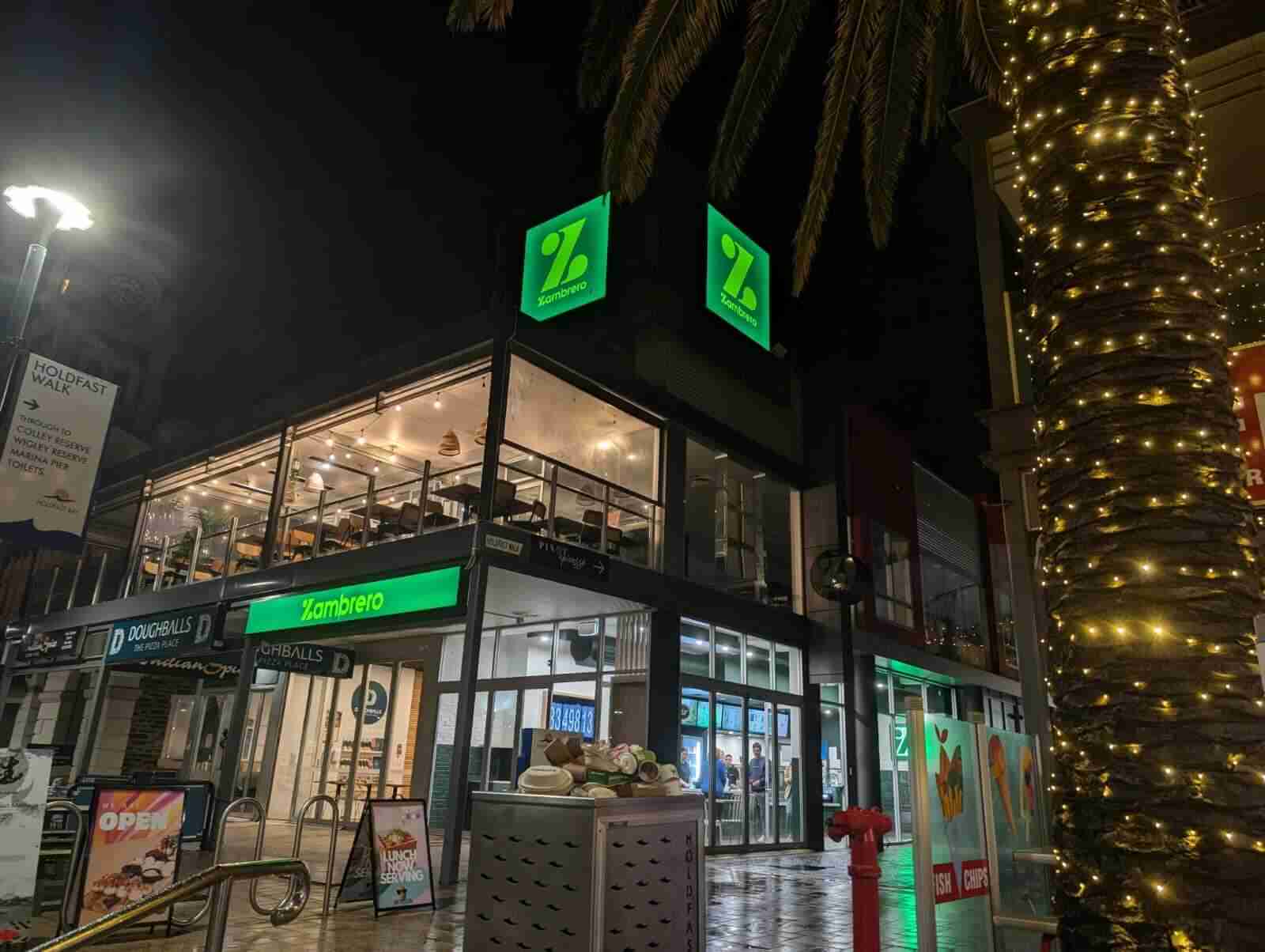 Brightly lit restaurant with large signage