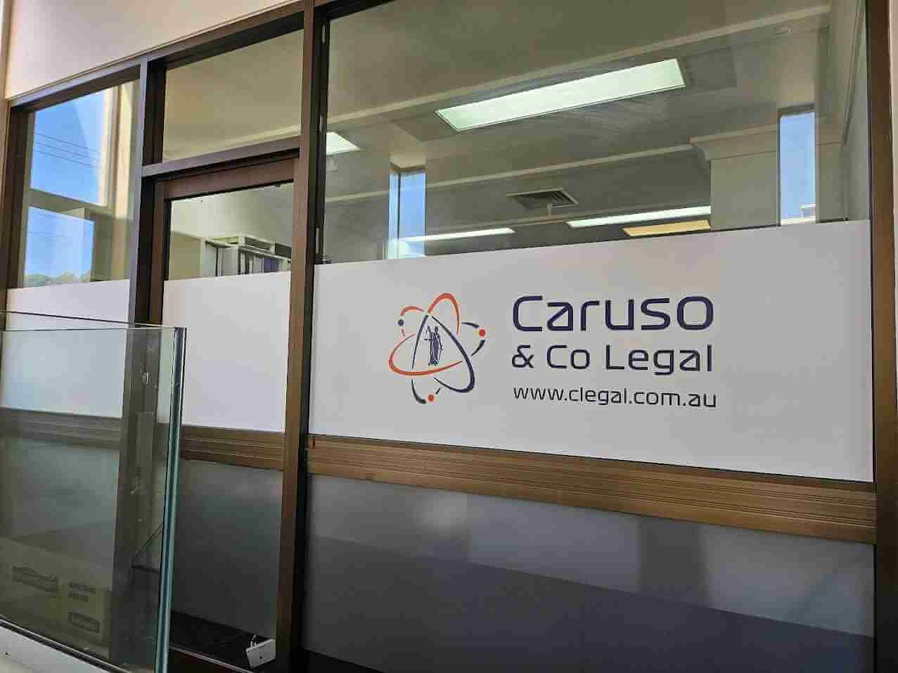 Caruso Co Legal frosted window signage with logo and website details