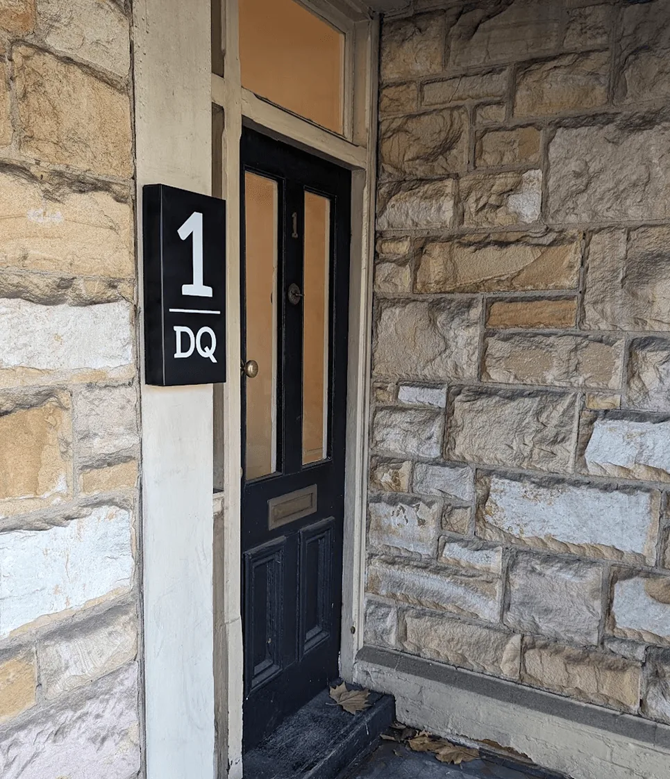 Black door with number 1